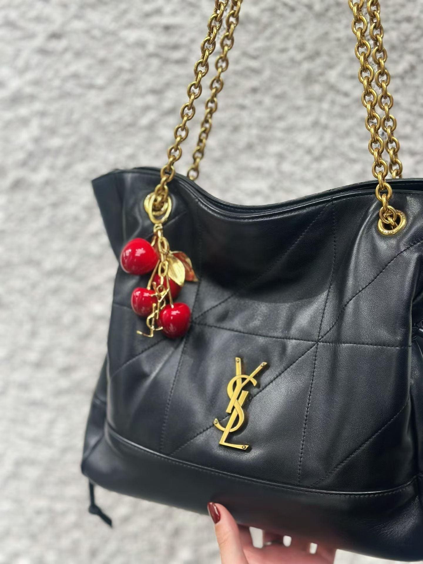 SAINT LAURENT CASSANDRE cherry bag charm in resin and metal