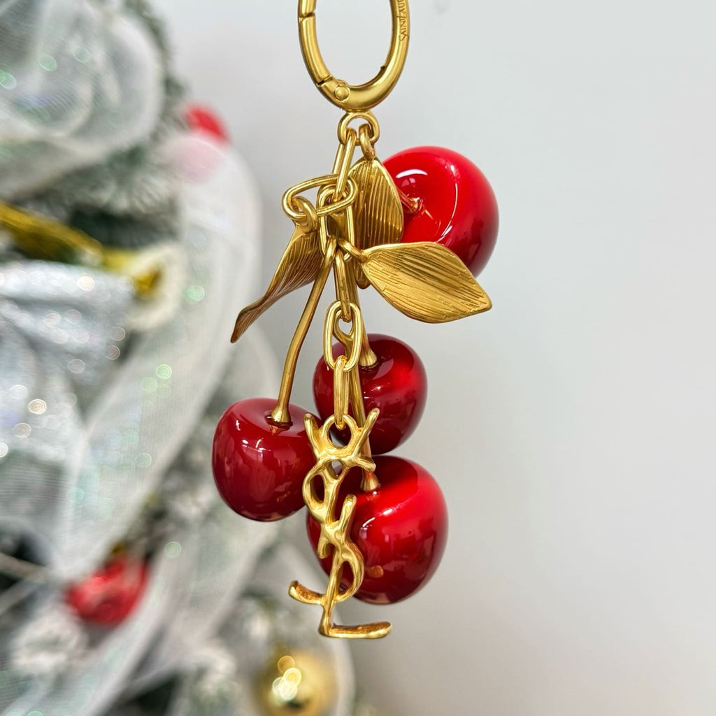 SAINT LAURENT CASSANDRE cherry bag charm in resin and metal