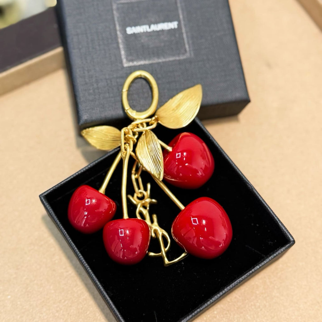 SAINT LAURENT CASSANDRE cherry bag charm in resin and metal