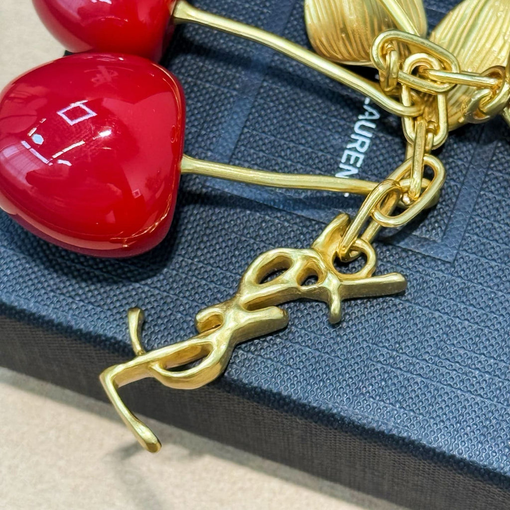 SAINT LAURENT CASSANDRE cherry bag charm in resin and metal